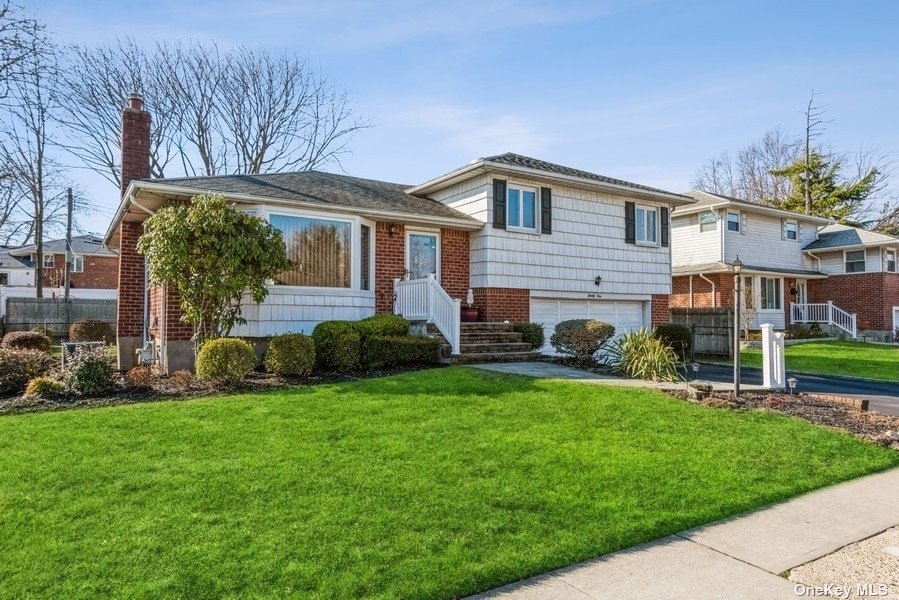 21 Vista Road Plainview, NY 11803 - Photo 1 of 1 a front view of house with yard and green space