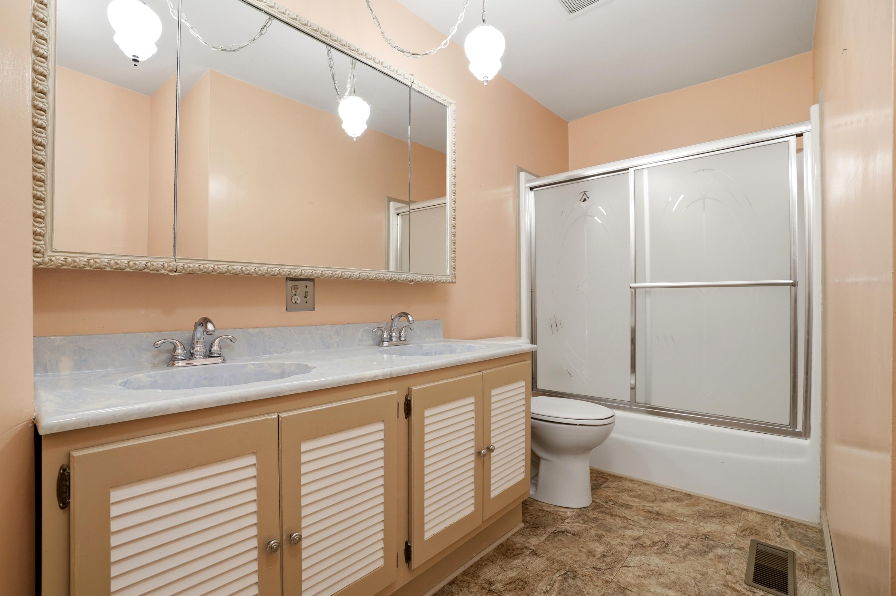 627 Olympia Road Valparaiso, IN 46385 - Photo 14 of 19 a bathroom with a granite countertop sink toilet and shower