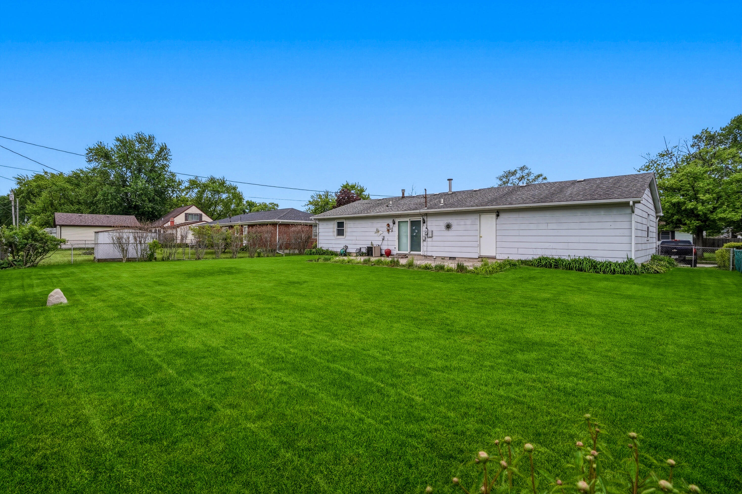 627 Olympia Road Valparaiso, IN 46385 - Photo 17 of 19 a view of a house with a yard and sitting area