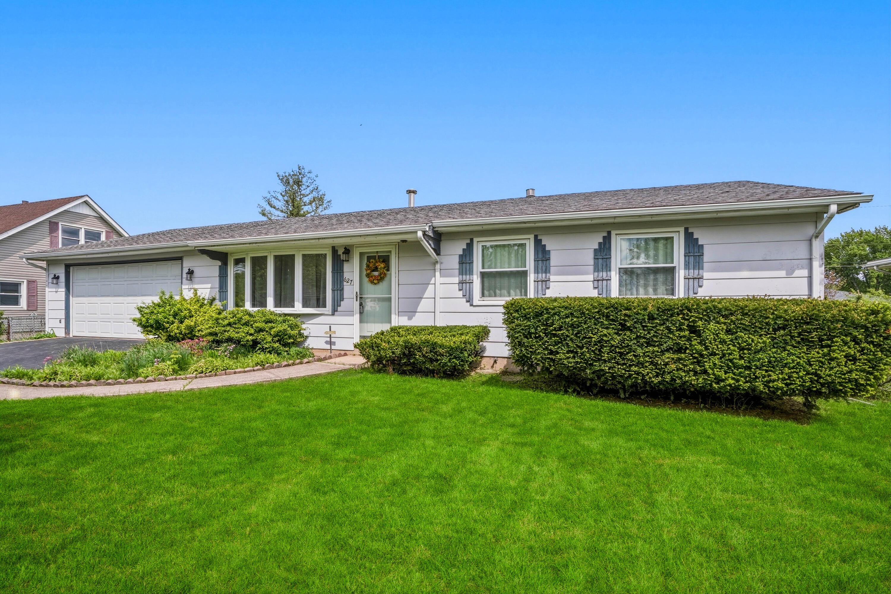 627 Olympia Road Valparaiso, IN 46385 - Photo 2 of 19 a front view of a house with a yard