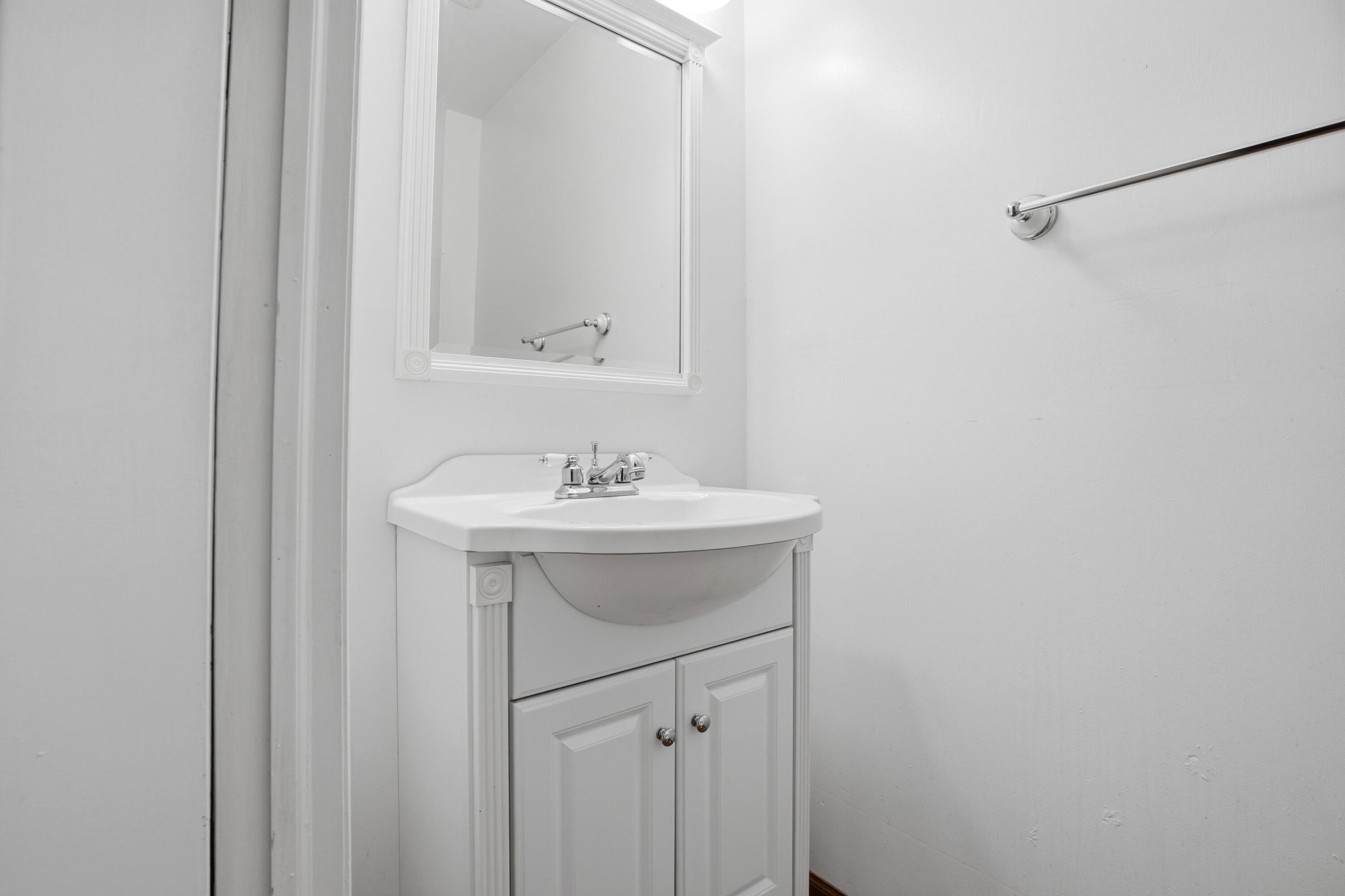 627 Olympia Road Valparaiso, IN 46385 - Photo 10 of 19 a bathroom with a sink a mirror and a vanity