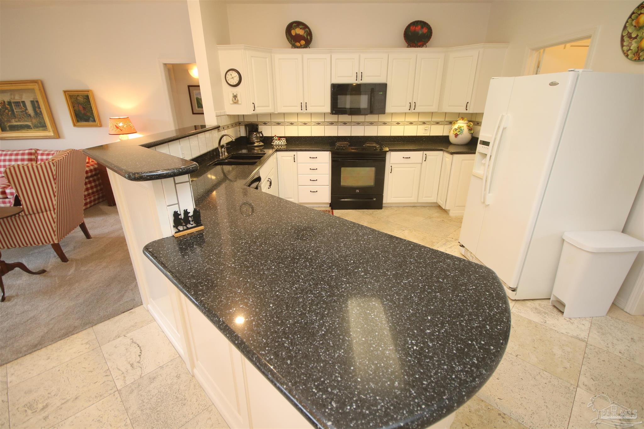 3286 Abel Avenue Pace, FL 32571 - Photo 12 of 55 range. Laundry room entrance to the left of fridge