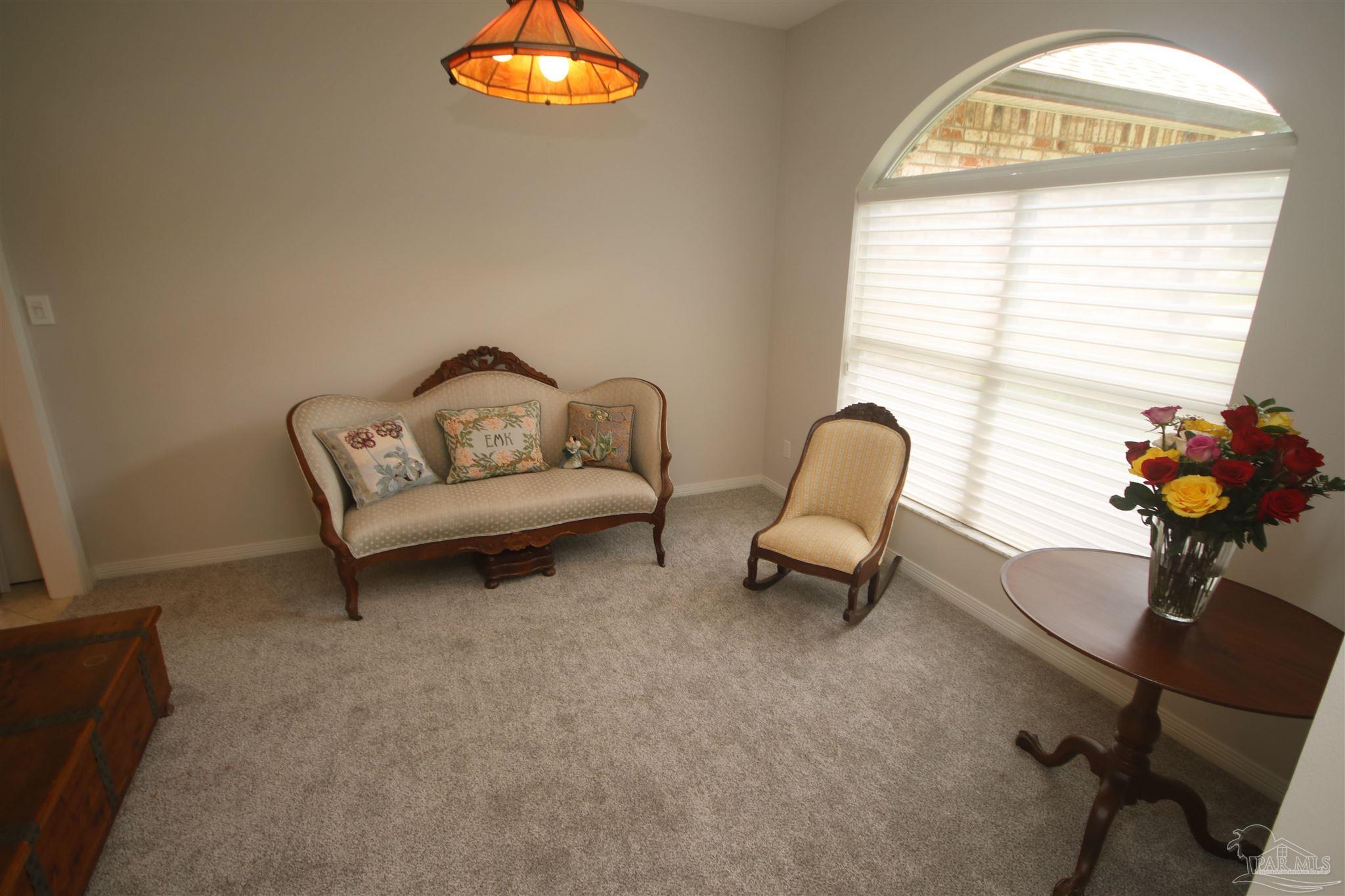 3286 Abel Avenue Pace, FL 32571 - Photo 19 of 55 a sitting area. Attractive Hunter Douglas shades.