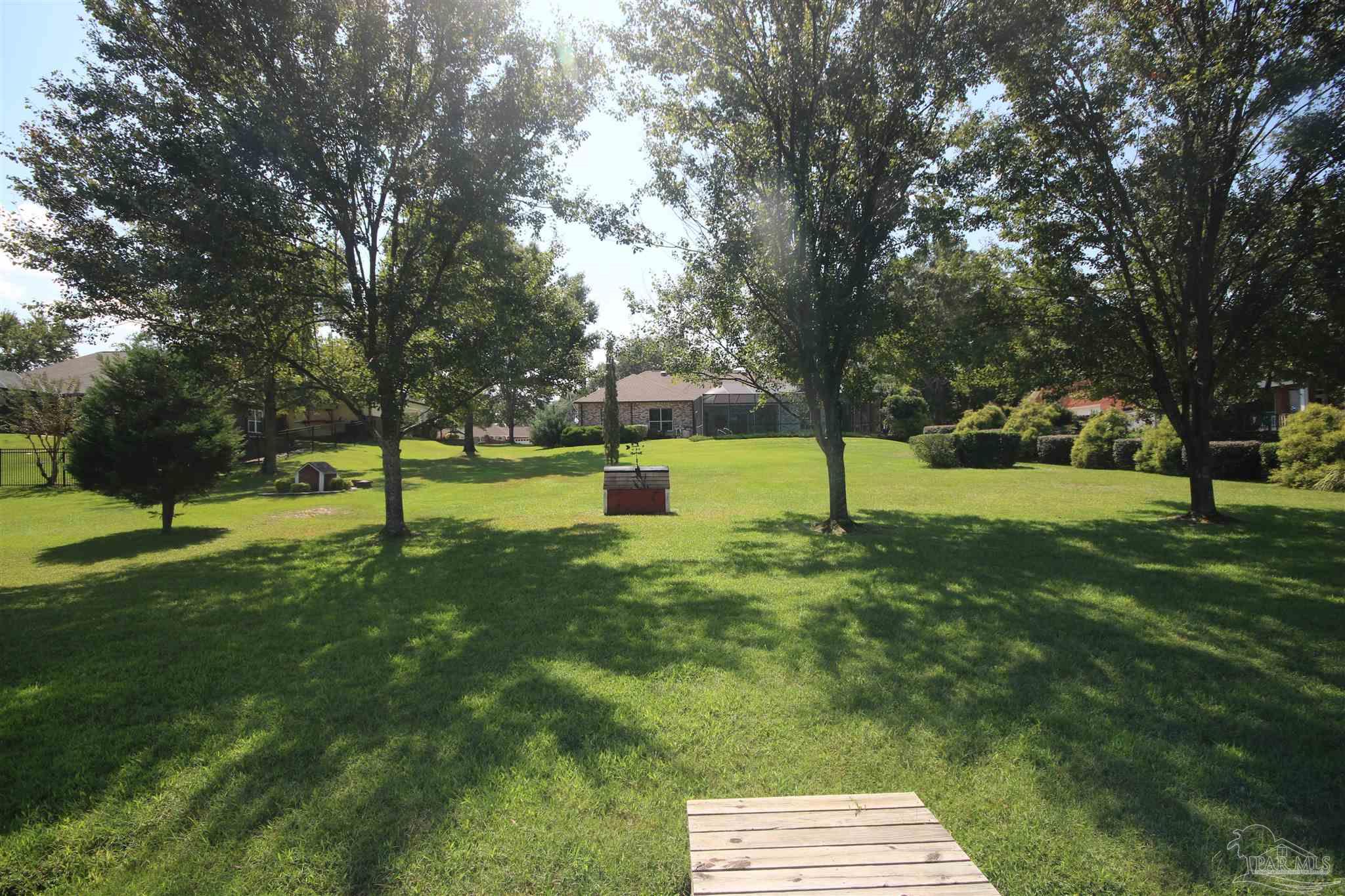 3286 Abel Avenue Pace, FL 32571 - Photo 2 of 55 Sprinkler syst.operates off lawn pump & lake water