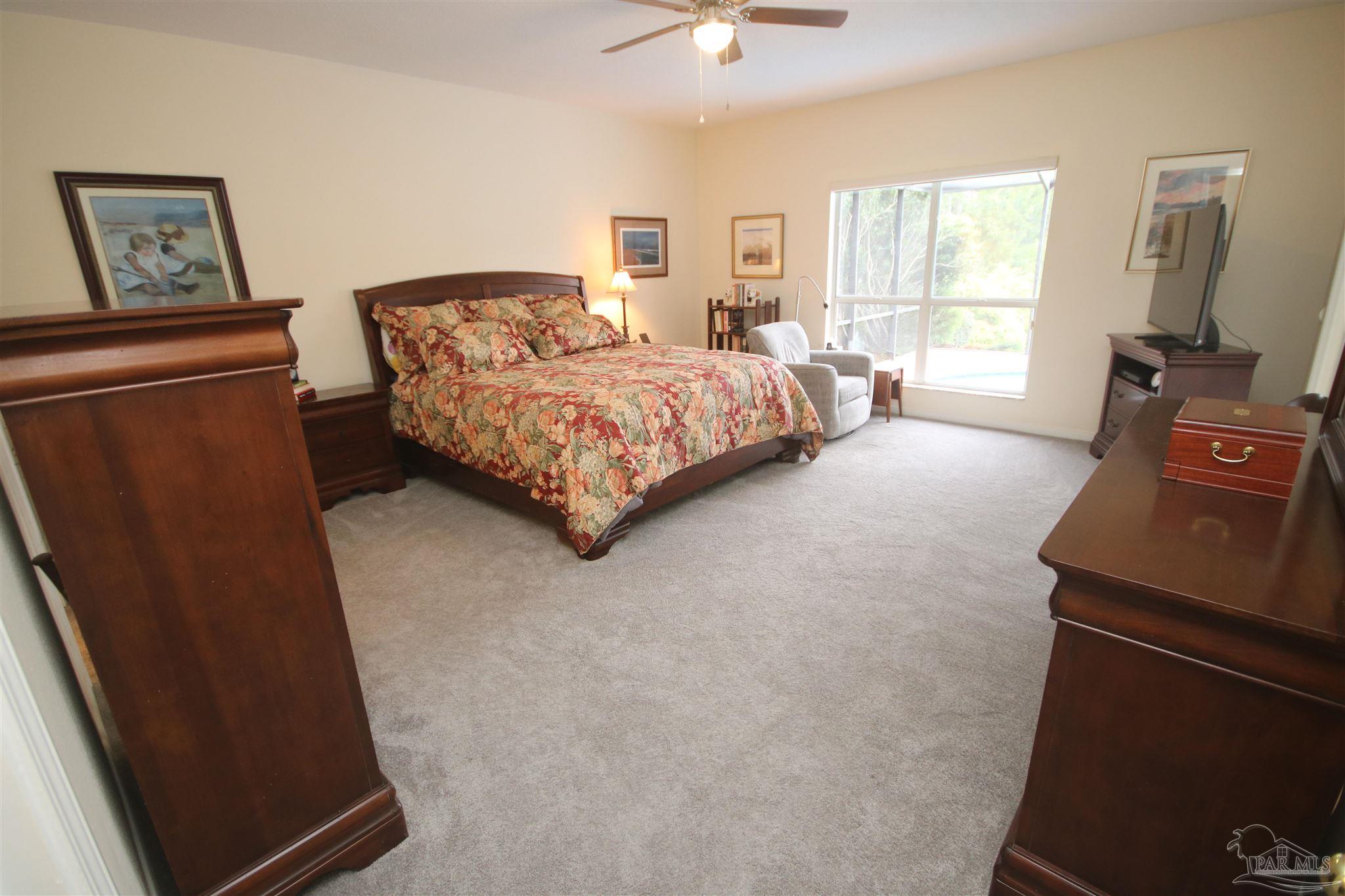 3286 Abel Avenue Pace, FL 32571 - Photo 22 of 55 VIew of the pool & lake from you bed.