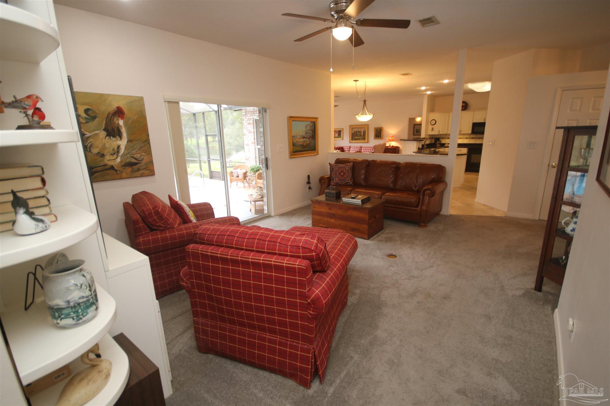 3286 Abel Avenue Pace, FL 32571 - Photo 6 of 55 ceiling fan in Family room. Coat closet to right.