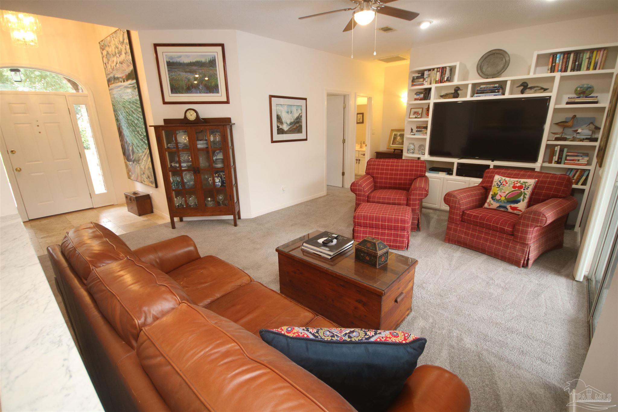 3286 Abel Avenue Pace, FL 32571 - Photo 8 of 55 Mast. & addit. bdrm & full bath to the left of TV.