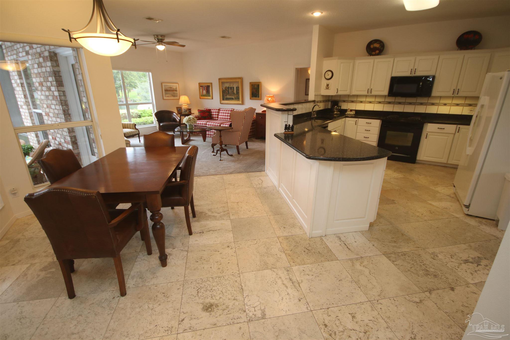 3286 Abel Avenue Pace, FL 32571 - Photo 9 of 55 with travertine flooring.
