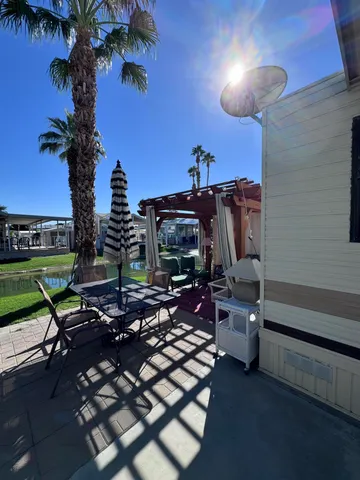 a view of a chairs and table in a patio