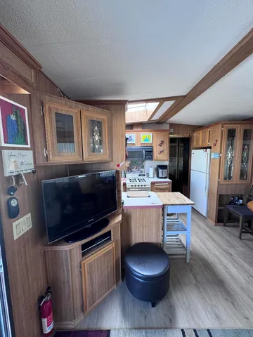 a living room with a fireplace furniture and a flat screen tv