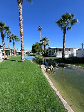 a view of a lake with a house in the background