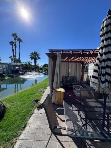 a view of a backyard with sitting area