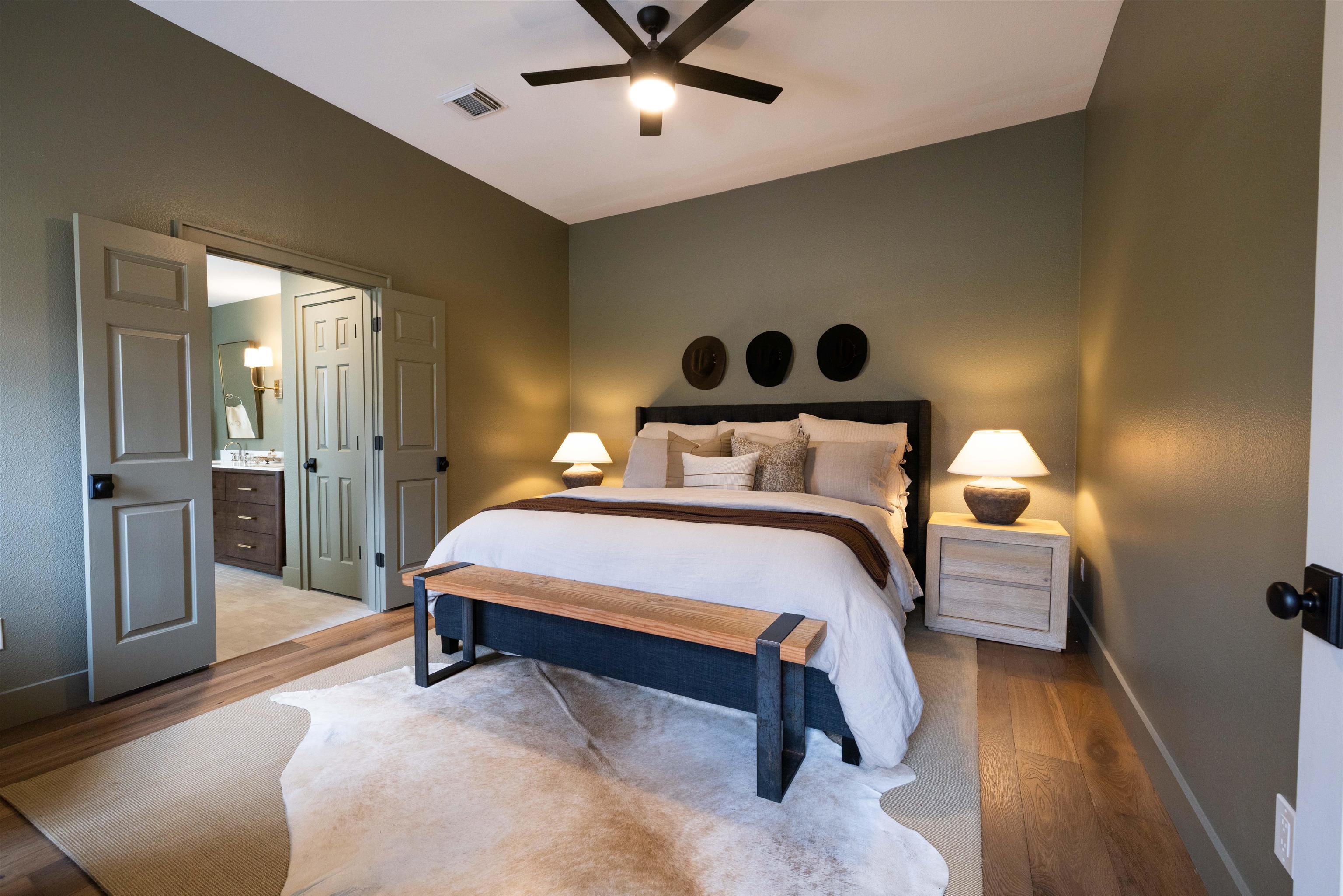 270 Chaparral Meadowlakes, TX 78654 - Photo 16 of 28 a bedroom with a bed and a chandelier
