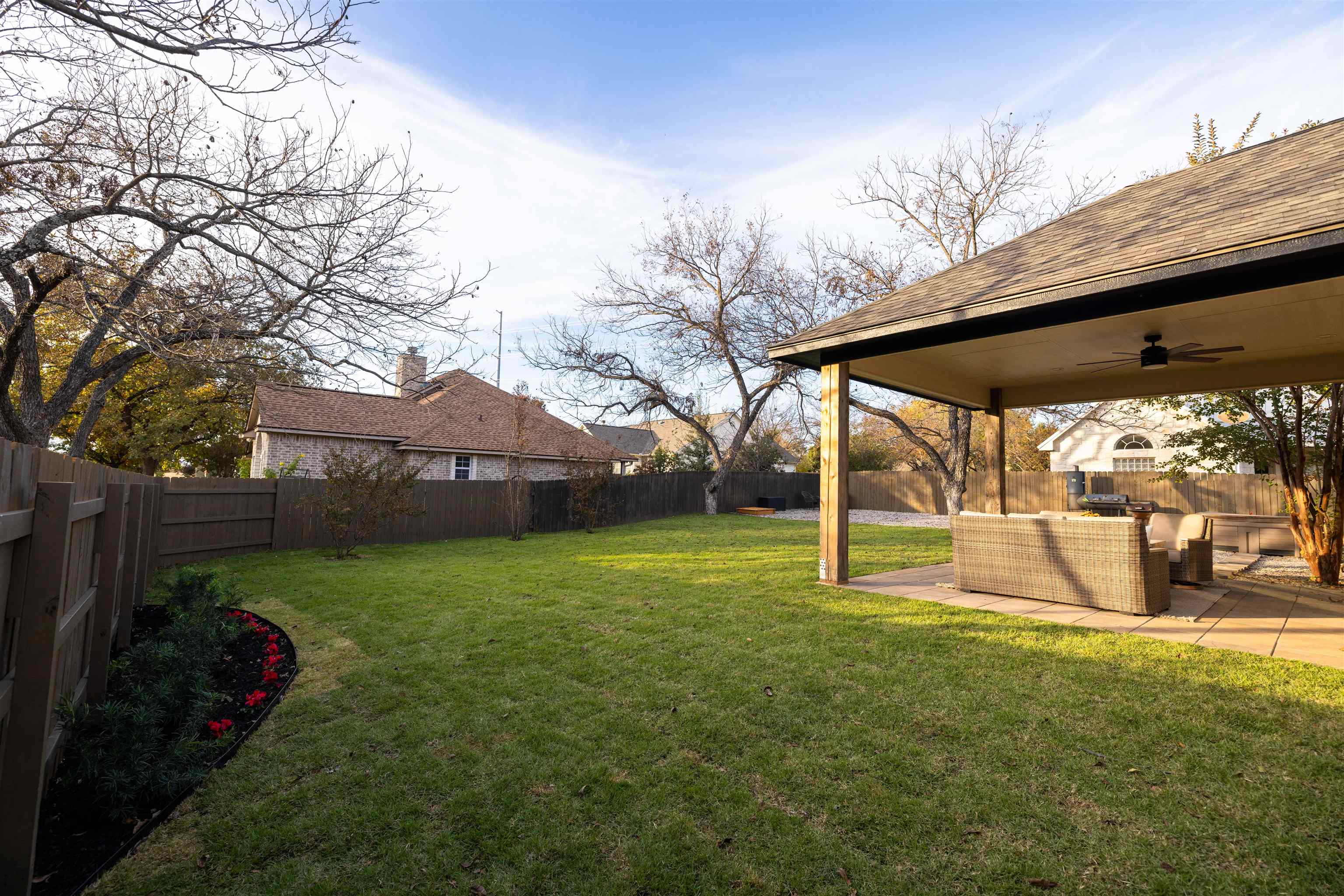 270 Chaparral Meadowlakes, TX 78654 - Photo 25 of 28 a view of a backyard with table and chairs under an umbrella