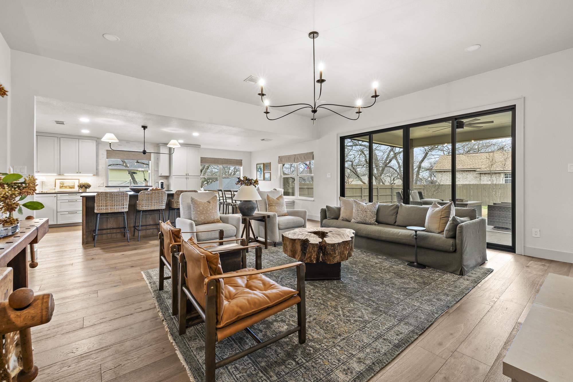 270 Chaparral Meadowlakes, TX 78654 - Photo 8 of 28 a living room with furniture kitchen view and a chandelier