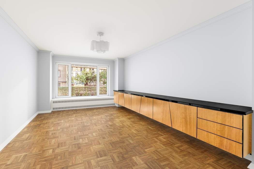 1050 5th Avenue, Unit 3B Manhattan, NY 10028 - Photo 6 of 13 a view of an empty room with a window