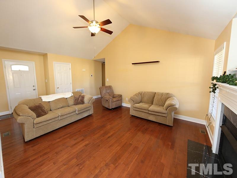 381 Hill Road Rougemont, NC 27572 - Photo 3 of 12 a living room with fireplace furniture and a flat screen tv