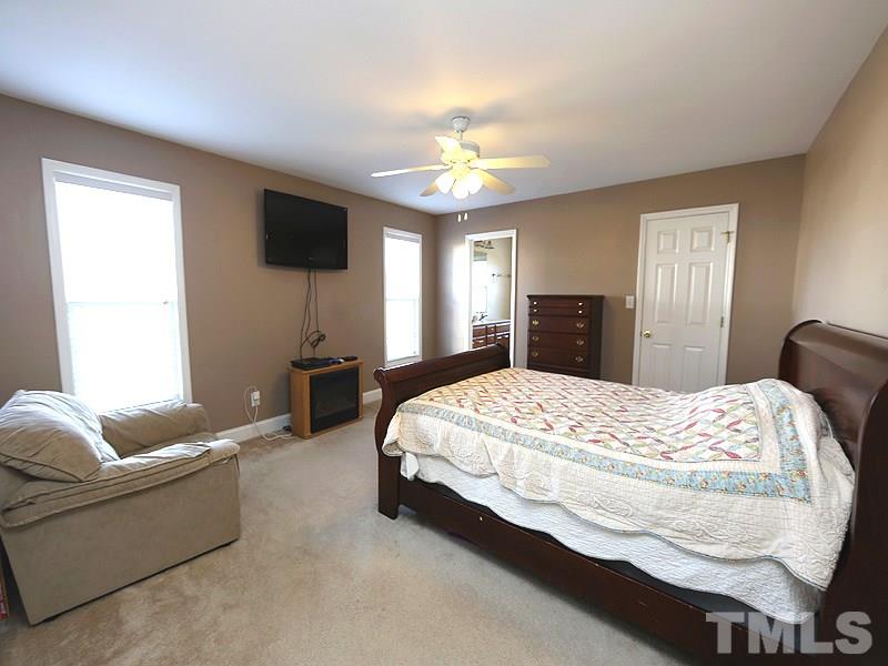 381 Hill Road Rougemont, NC 27572 - Photo 8 of 12 a bedroom with a bed couch and window