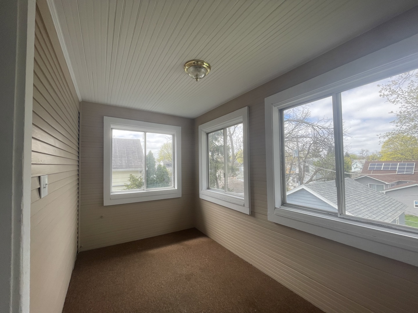 710 North Poplar Street, Unit 2 Waukegan, IL 60085 - Photo 16 of 16 an empty room with windows