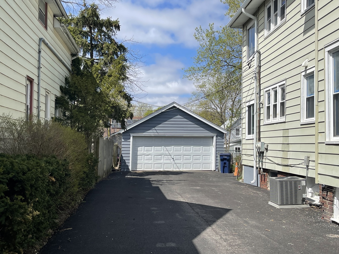 710 North Poplar Street, Unit 2 Waukegan, IL 60085 - Photo 2 of 16 a view of a house with a yard and garage