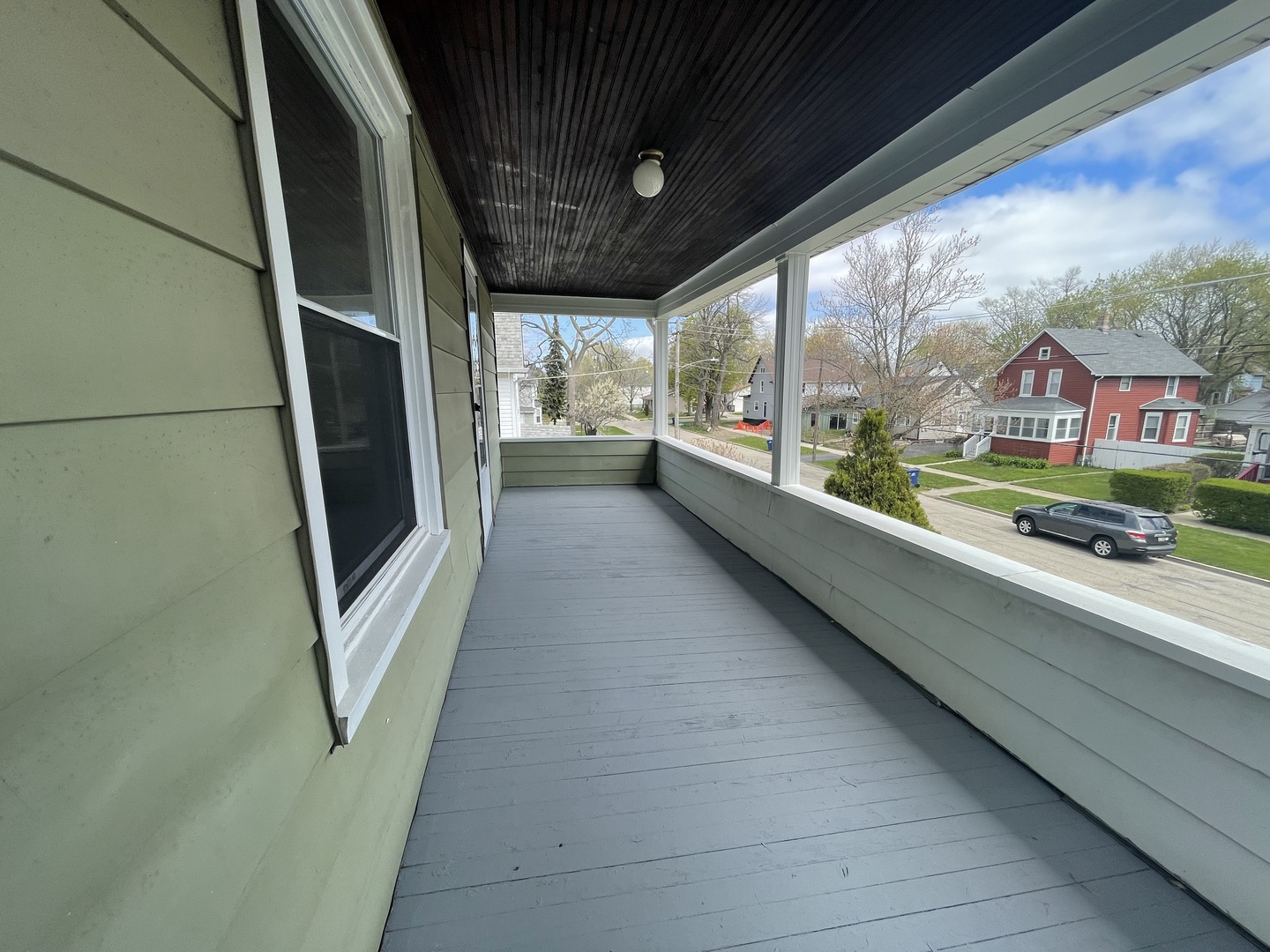 710 North Poplar Street, Unit 2 Waukegan, IL 60085 - Photo 4 of 16 a view of a porch with furniture and a gate