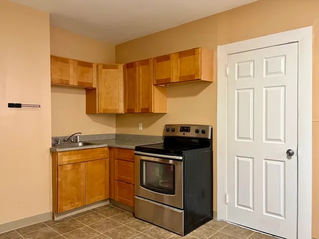 a kitchen with a stove and a sink