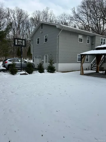 a view of parking area with cars parked