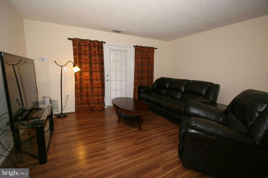 21013 Timber Ridge Terrace, Unit 103 Ashburn, VA 20147 - Photo 8 of 16 Living Room