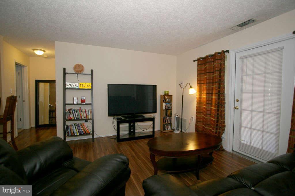 21013 Timber Ridge Terrace, Unit 103 Ashburn, VA 20147 - Photo 9 of 16 Living Room