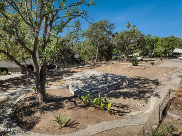 a view of a backyard of the house