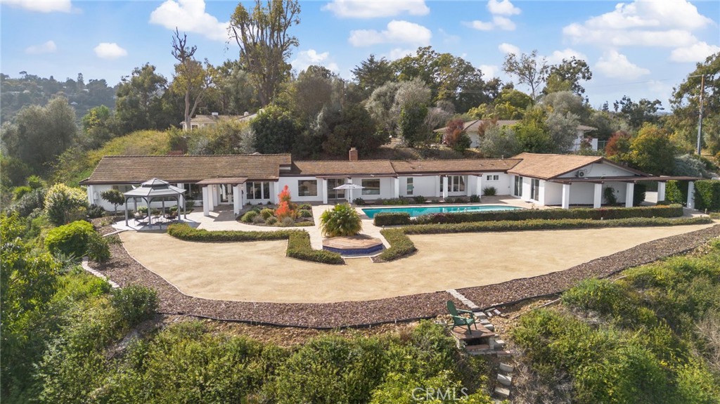 88 Saddleback Road Rolling Hills, CA 90274 - Photo 1 of 1 an aerial view of residential houses with outdoor space and swimming pool