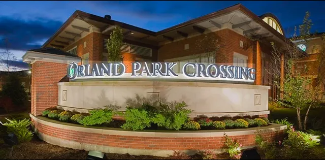 a street sign on a wall next to a building