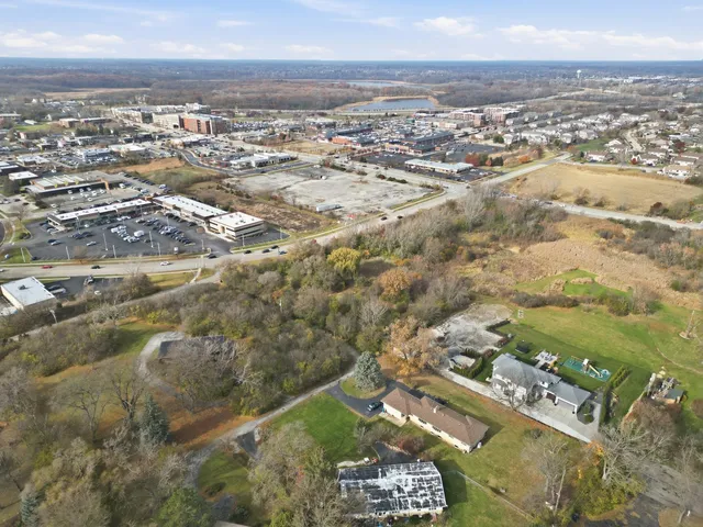 an aerial view of residential building with parking space