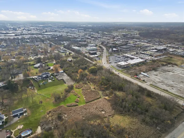 an aerial view of residential houses with outdoor space