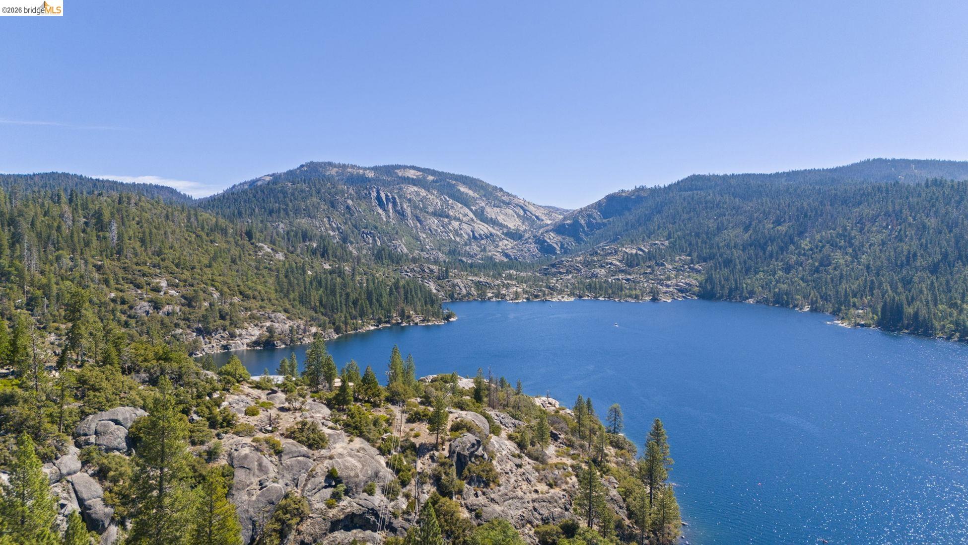 26570 Crystal Road Long Barn, CA 95335 - Photo 32 of 39 Expansive body of water surrounded by evergreen forests and natural rock formations