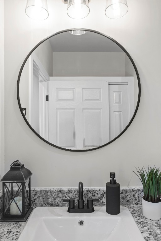 1003 Friendship Lane, Unit 301 Fredericksburg, TX 78624 - Photo 14 of 19 a bathroom with a sink and a mirror