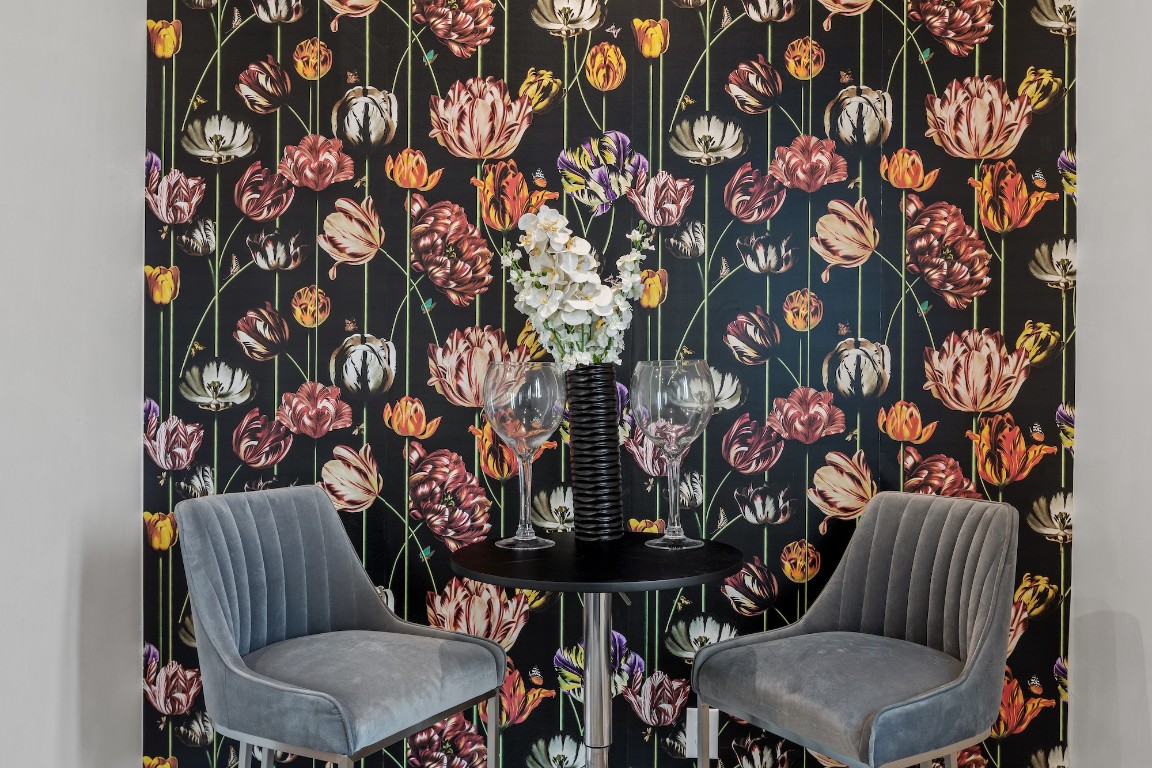 1003 Friendship Lane, Unit 301 Fredericksburg, TX 78624 - Photo 5 of 19 a view of a chairs and table in a patio