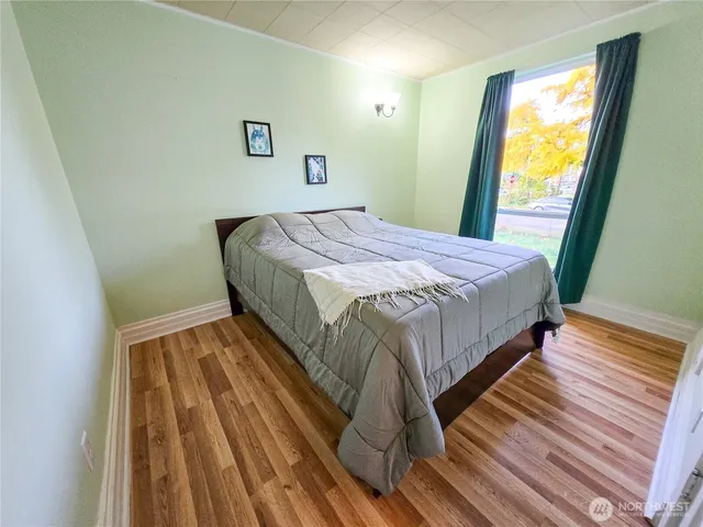 a large kitchen with stainless steel appliances granite countertop a lot of counter space and a sink