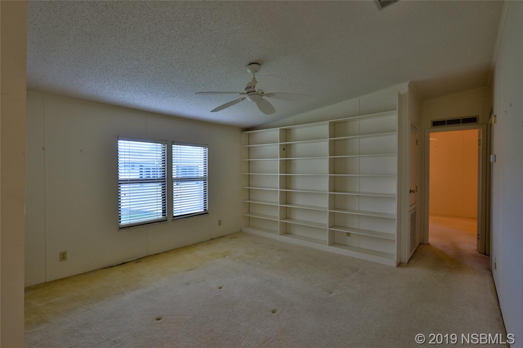 803 Navigators Way Edgewater, FL 32141 - Photo 14 of 27 a view of an empty room with a window