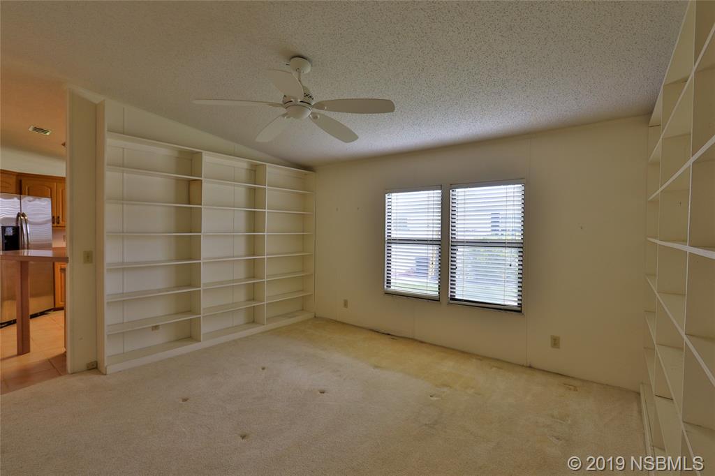 803 Navigators Way Edgewater, FL 32141 - Photo 15 of 27 a view of an empty room with a window