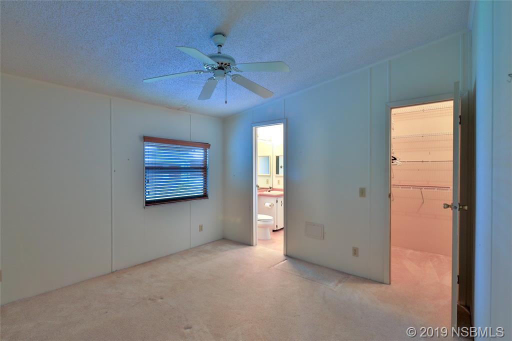 803 Navigators Way Edgewater, FL 32141 - Photo 16 of 27 a view of an empty room with a window