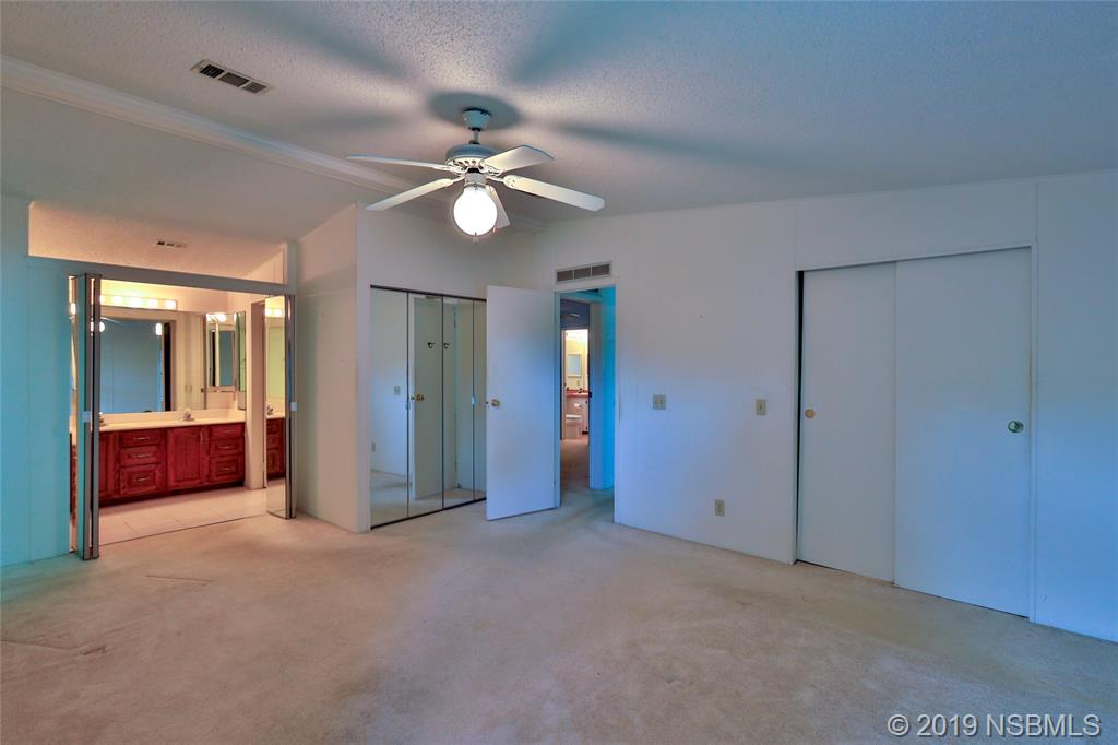 803 Navigators Way Edgewater, FL 32141 - Photo 18 of 27 a view of empty room with windows