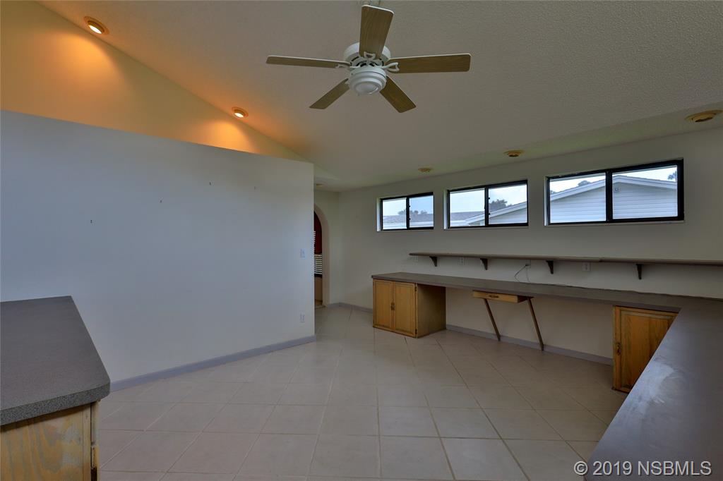 803 Navigators Way Edgewater, FL 32141 - Photo 24 of 27 a view of game room with windows