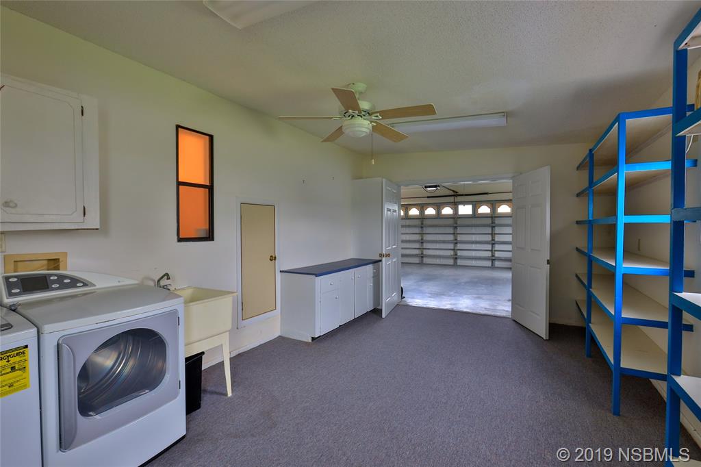 803 Navigators Way Edgewater, FL 32141 - Photo 26 of 27 a view of storage and utility room
