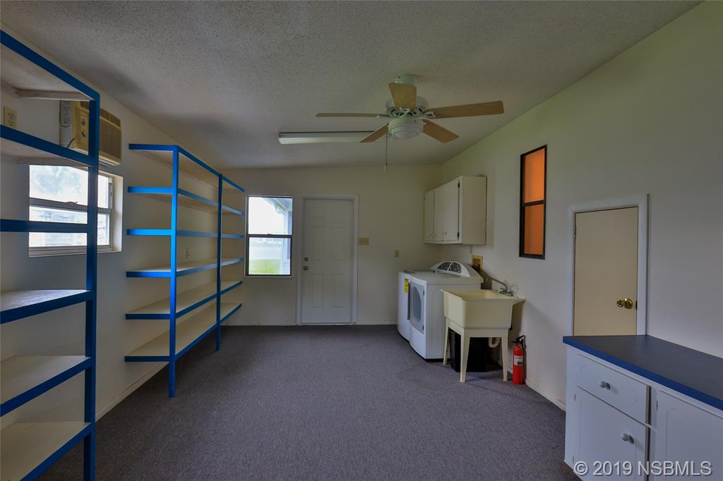 803 Navigators Way Edgewater, FL 32141 - Photo 27 of 27 a room with stairs and furniture