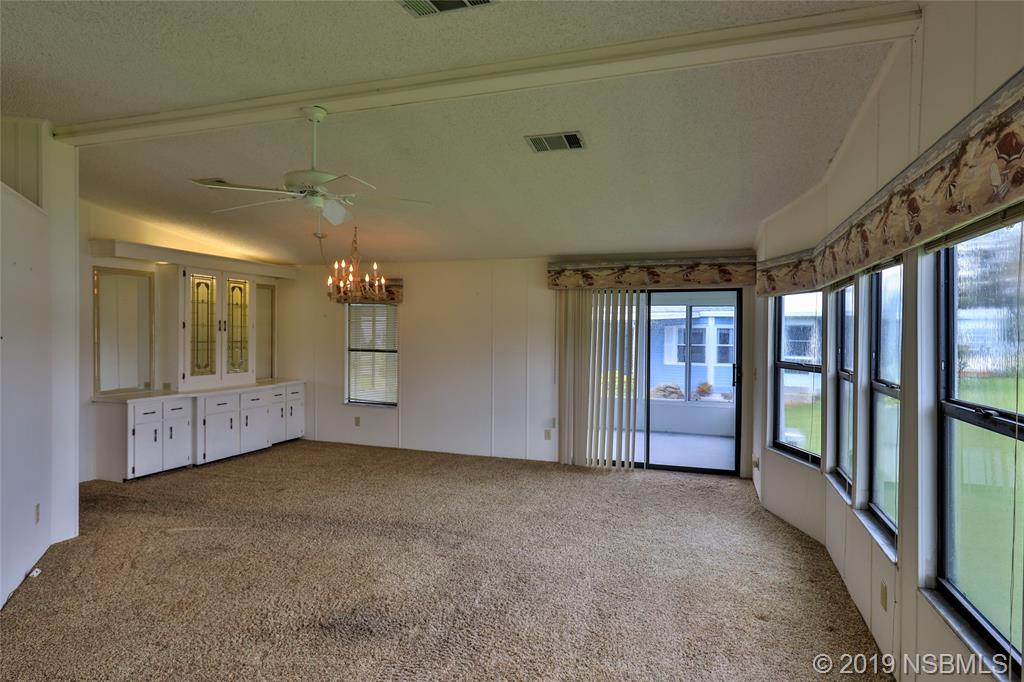 803 Navigators Way Edgewater, FL 32141 - Photo 8 of 27 a view of an empty room with a window
