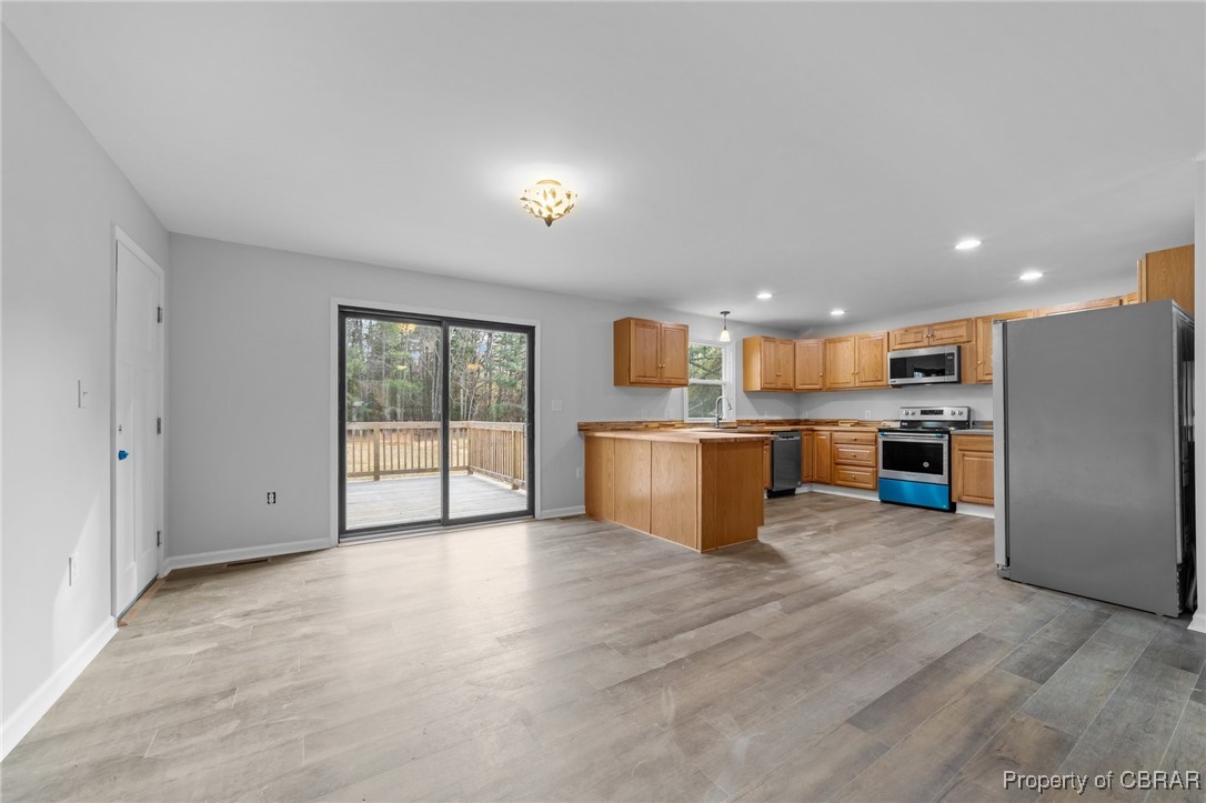 3816 Cappahosic Road Gloucester, VA 23061 - Photo 12 of 28 Kitchen and Dining Area leading out to the deck