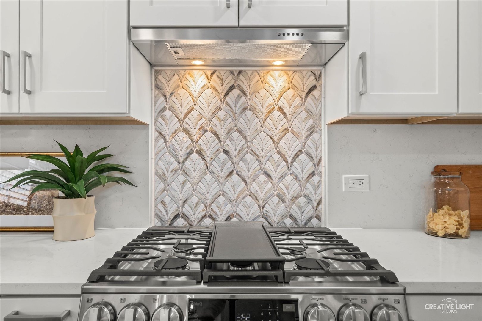 704 Plainfield Road Downers Grove, IL 60516 - Photo 11 of 36 a stove top oven sitting inside of a kitchen