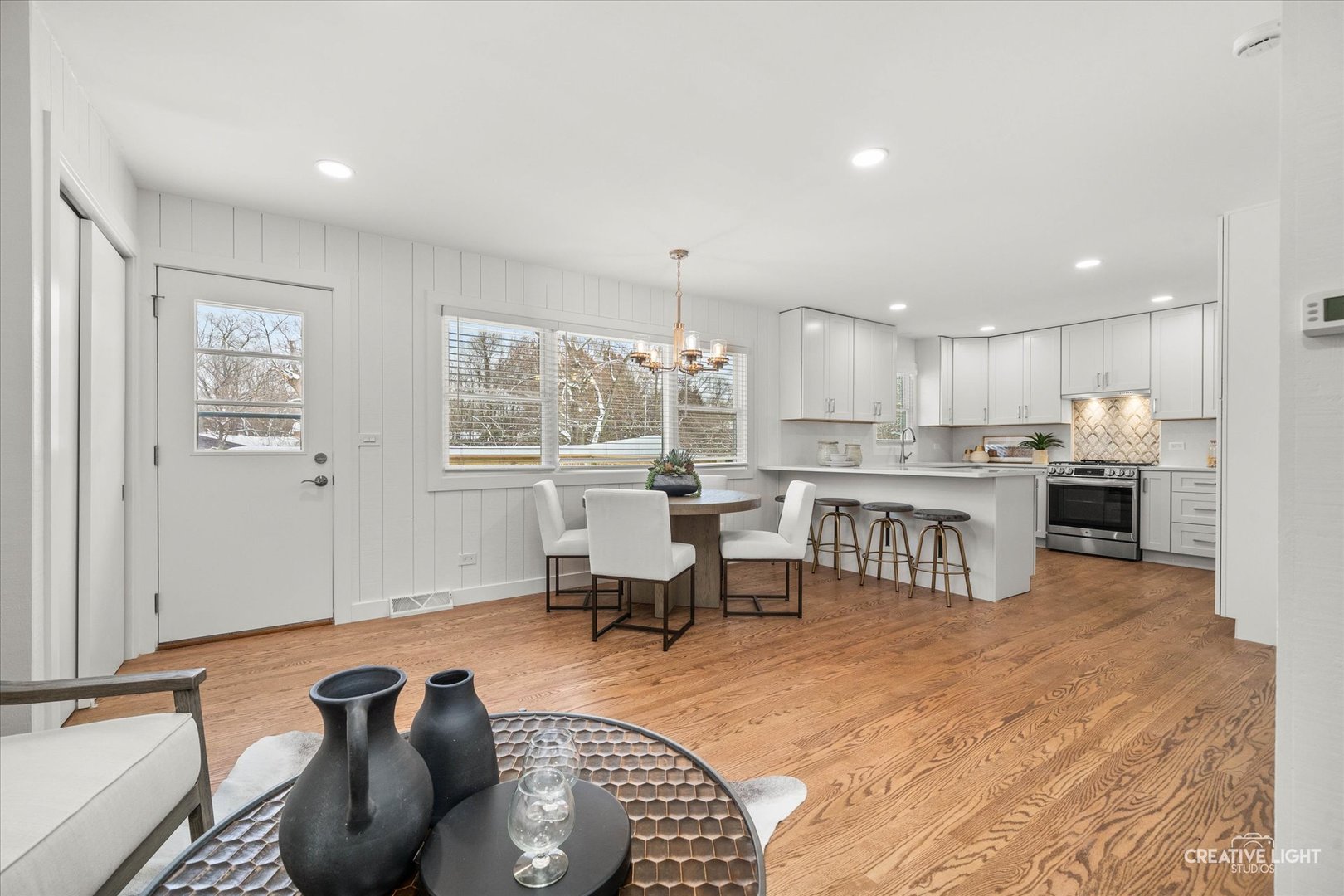 704 Plainfield Road Downers Grove, IL 60516 - Photo 12 of 36 a living room with furniture and kitchen view