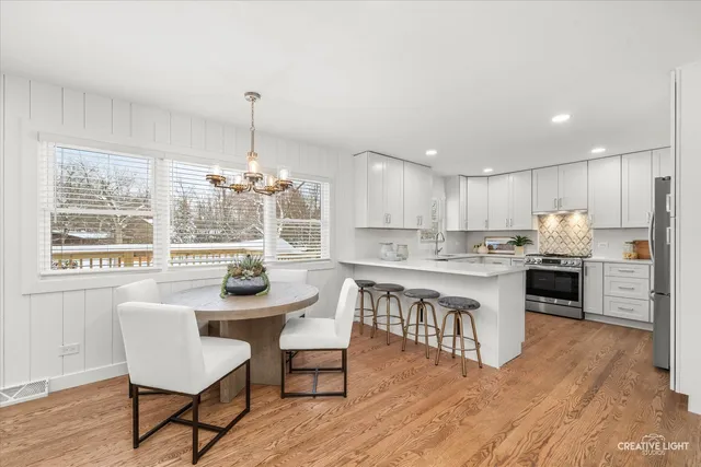 a kitchen with kitchen island granite countertop a sink and counter space